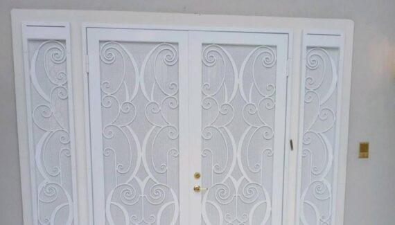 A wrought iron security door installed in a home with an HOA.