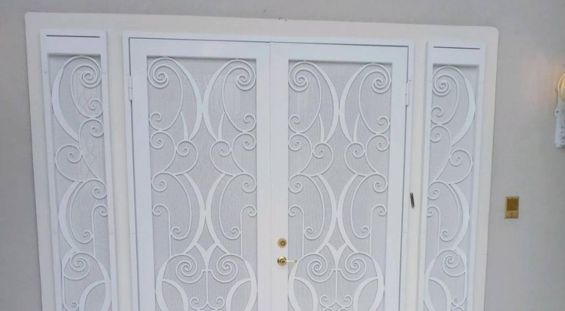 A wrought iron security door installed in a home with an HOA.