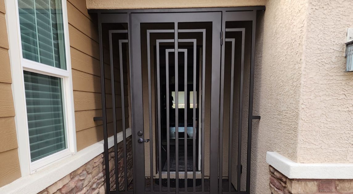 Decorative, geometric, bronze iron front door.