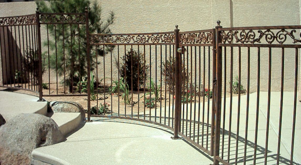 An inside look of wrought iron pool fencing.