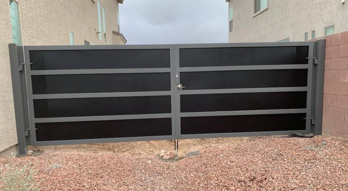 A wrought iron gate guarding a business property.